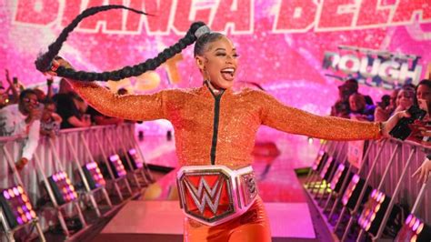 WWE star Bianca Belair flaunts figure in tiny bikinis for。